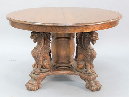 ROUND OAK DINING TABLE HAVING