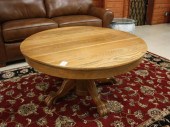 ROUND OAK PEDESTAL COFFEE TABL