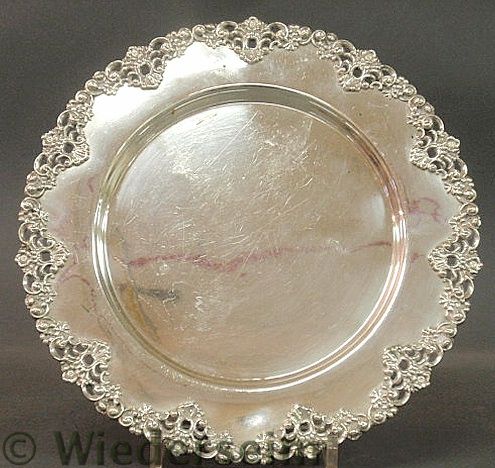 Round sterling silver tray with a