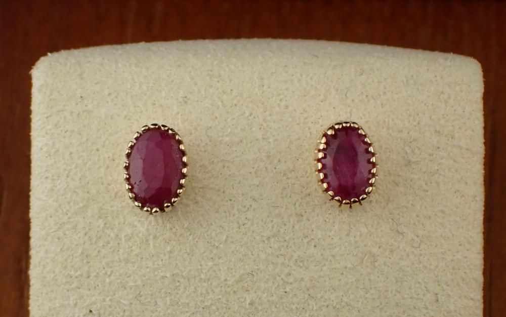 RUBY AND FOURTEEN KARAT GOLD EAR