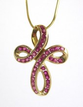 RUBY AND FOURTEEN KARAT GOLD C