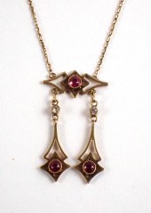 RUBY AND FOURTEEN KARAT YELLOW