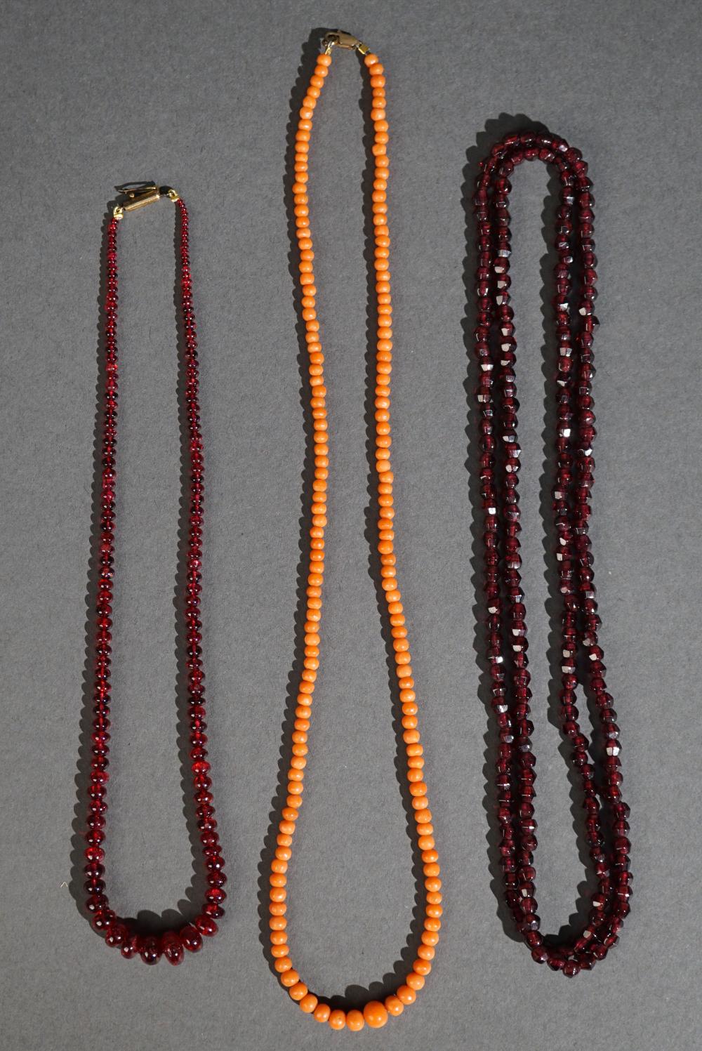RUBY BEAD NECKLACE, A CORAL BEAD