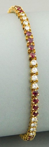 RUBY, DIAMOND AND 18K YELLOW G
