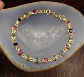 RUBY, SAPPHIRE AND YELLOW GOLD
