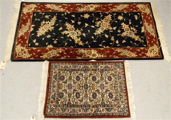 Rug  black field  red border 