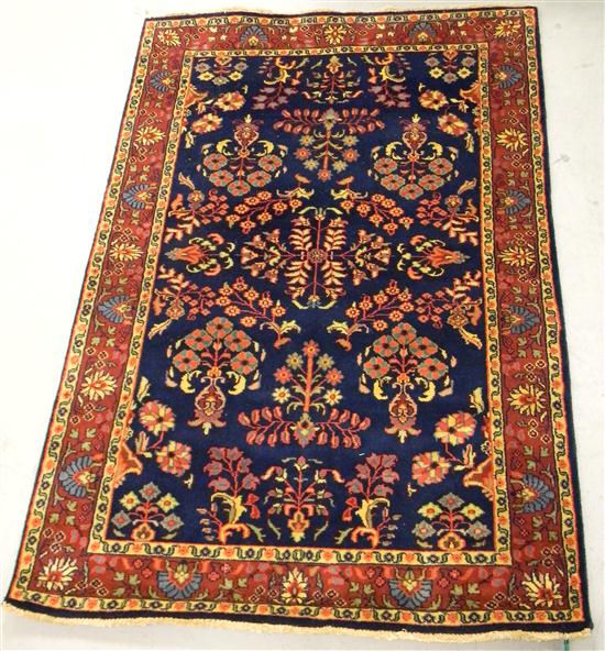 Rug with navy field and red border
