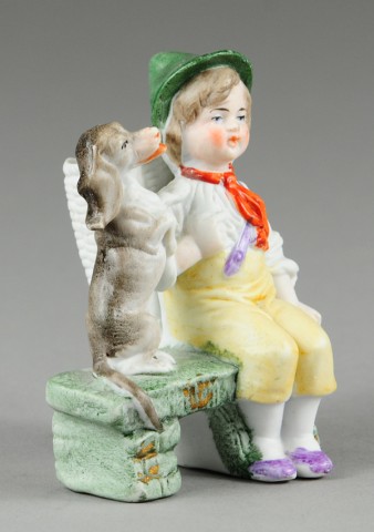 SEATED CHILD WITH DOG TOOTHPICK