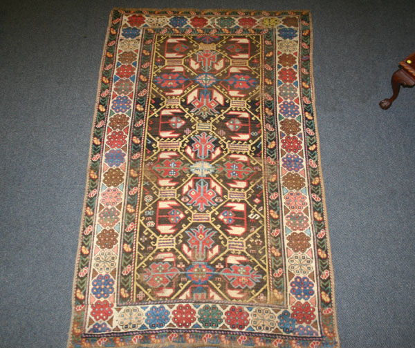 Semi antique area rug; 50" x 84".