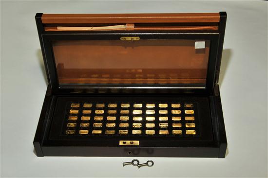 SET OF CASED 24K GOLD INGOTS. Fifty