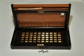 SET OF CASED 24K GOLD INGOTS.