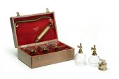 SET OF CASED BLEEDING CUPS.  F