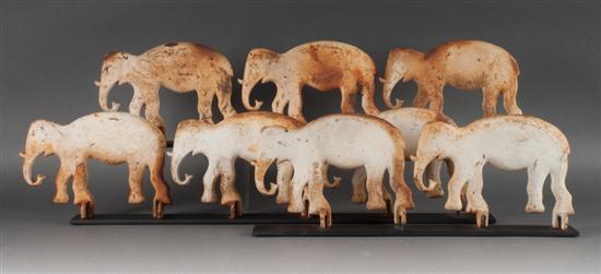 Set of eight painted cast iron