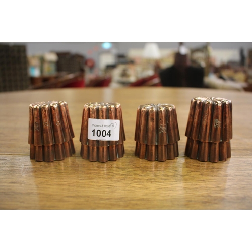 Set of eight petit antique copper