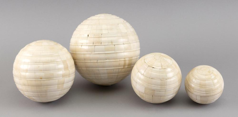 SET OF FOUR BONE CARPET BALLS