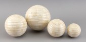 SET OF FOUR BONE CARPET BALLS