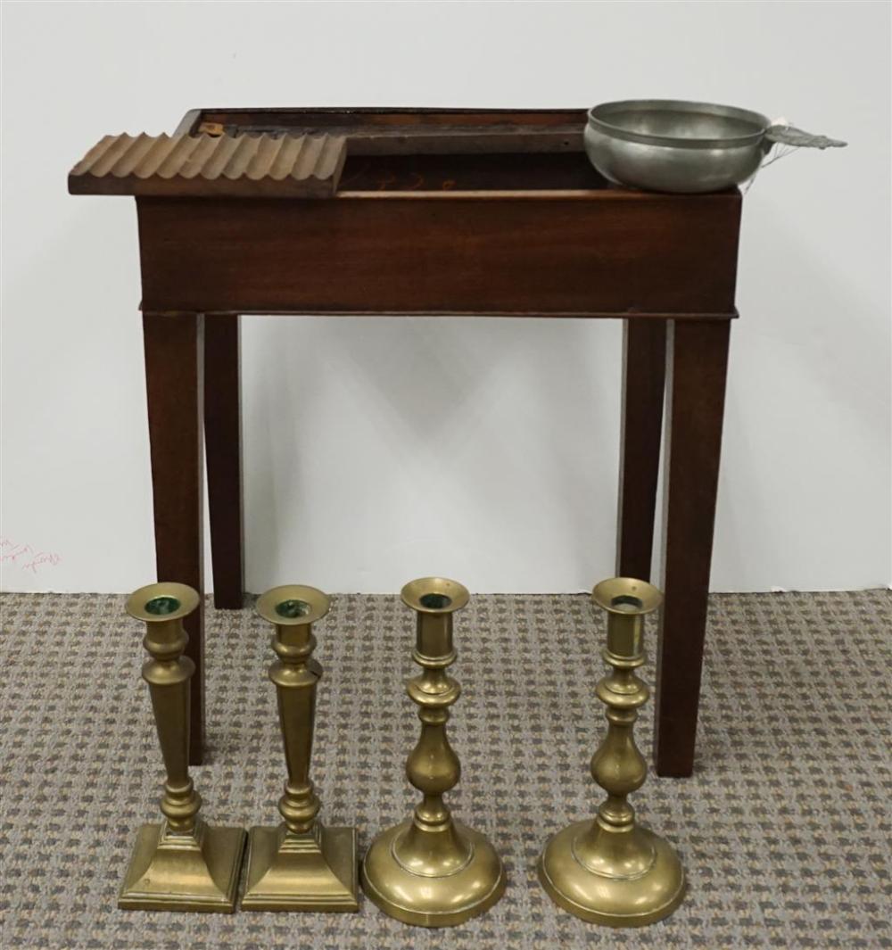 SET OF FOUR BRASS CANDLESTICKS, A