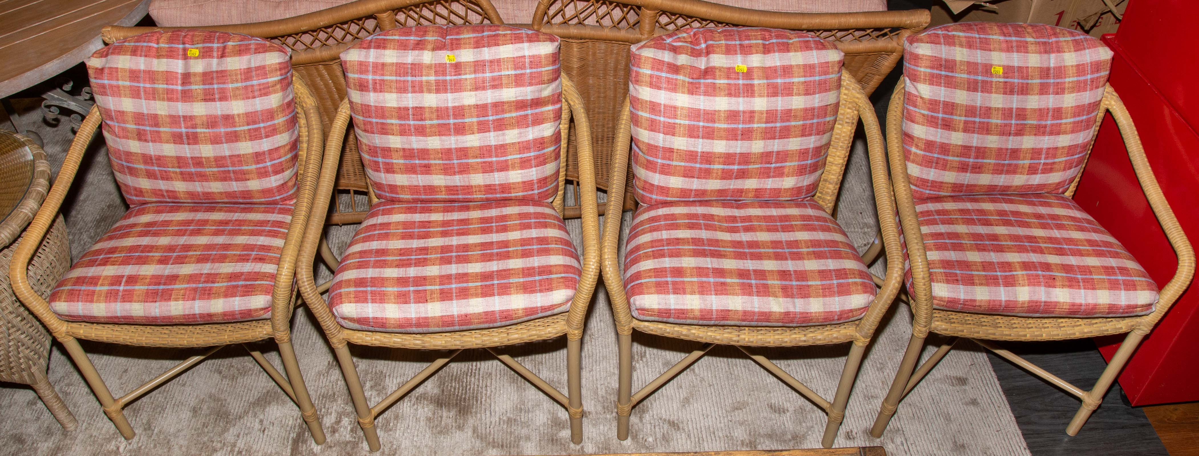SET OF FOUR RATTAN ARM CHAIRS