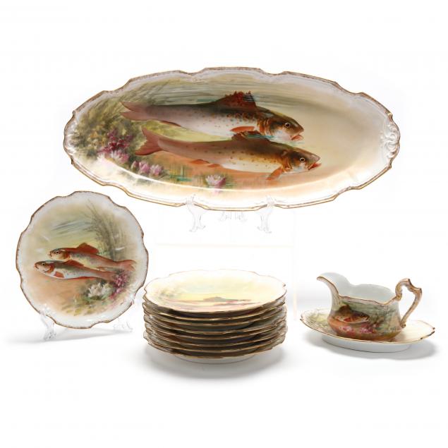 SET OF LIMOGES FISH TABLEWARE, 12