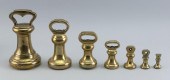 SET OF SEVEN BRASS BELL WEIGHT