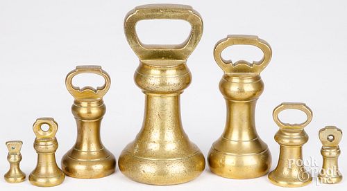 SET OF SEVEN BRASS BELL SCALE