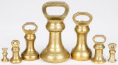 SET OF SEVEN BRASS BELL SCALE