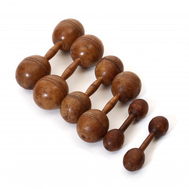 SET OF SIX TURNED WOOD DUMBBELLS