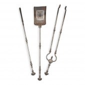 SET OF STEEL FIRE TOOLS AND AN