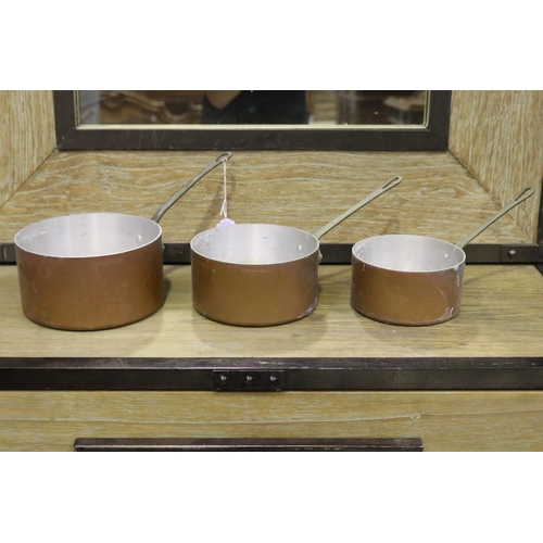 Set of three French saucepans,