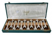 SET OF TWELVE CASED SILVER PLA