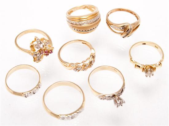 Seven 14K yellow gold and diamond