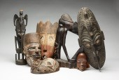 SEVEN AFRICAN WOODEN MASKS AND