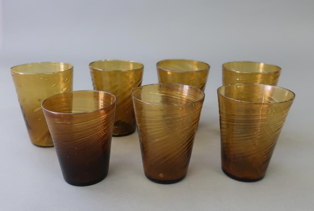 Seven amber blown glass swirl