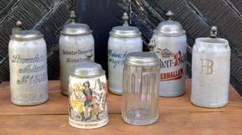 Seven antique beer steins,