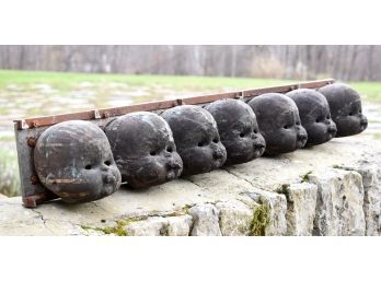 Seven antique steel factory molds