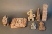 SEVEN ARCHAIC STYLE CARVED STO