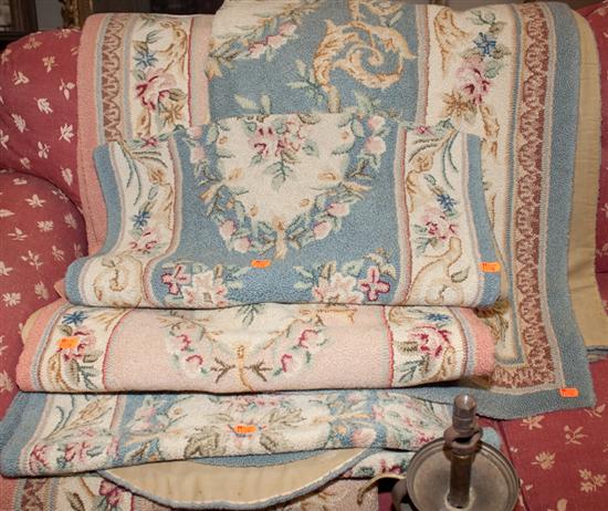 Seven assorted needlepoint rugs