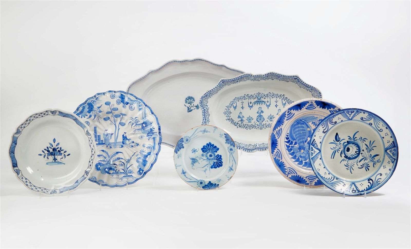 SEVEN BLUE AND WHITE TIN GLAZED