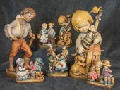 SEVEN CARVED WOOD ANRI FIGURES