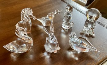 Seven clear glass animal figurines,