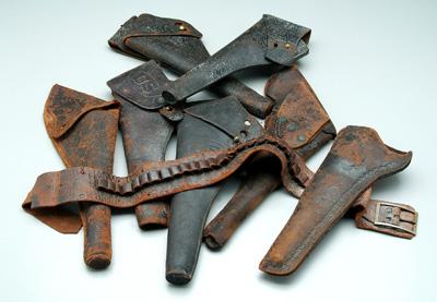 Seven Colt-related holsters: one