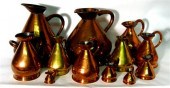 Seven copper and brass graduat
