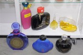 SEVEN FACTICE PERFUME BOTTLES.