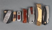 Seven folding pocket knives by