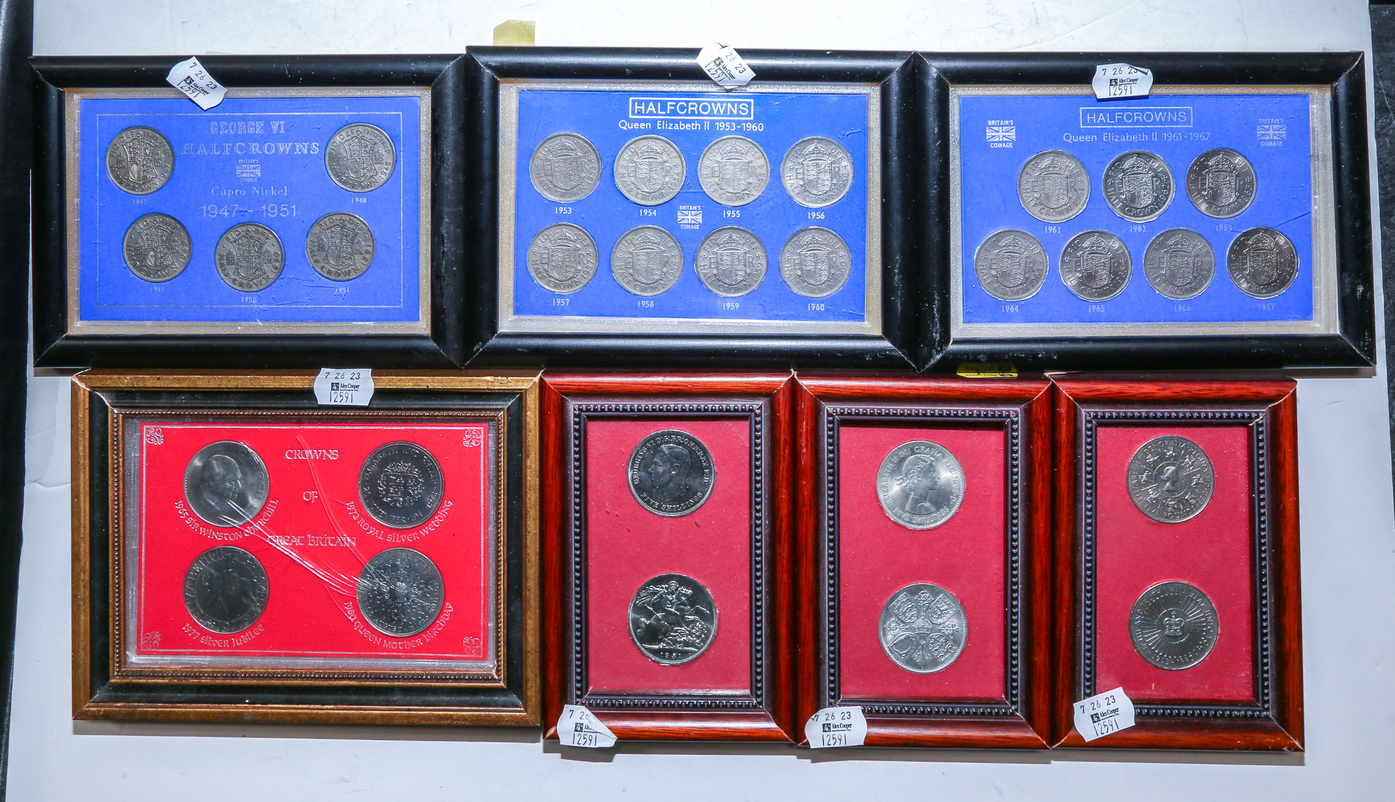 SEVEN FRAMED SETS OF UK CROWNS &