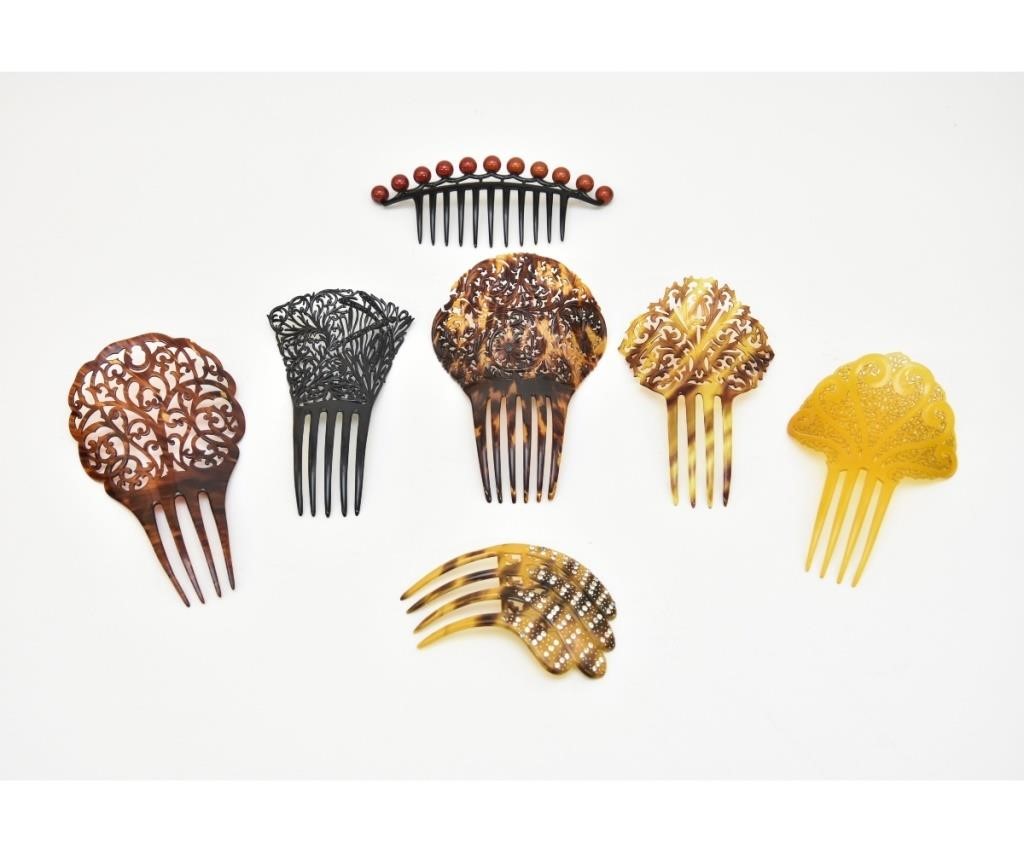 Seven French celluloid/plastic hair
