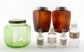 SEVEN GLASS BOTTLES AND JARS A