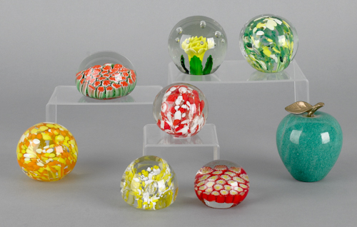 Seven glass paperweights together