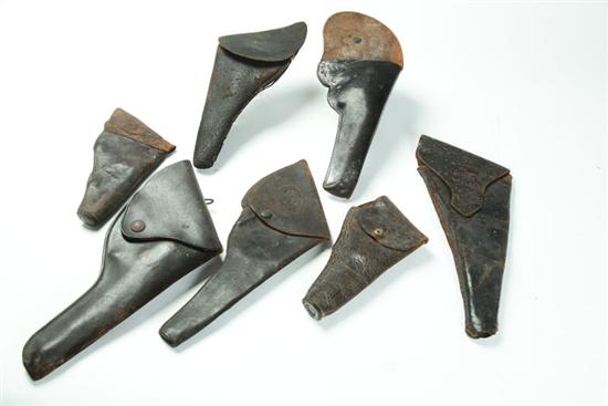 SEVEN HOLSTERS.  Includes a flap
