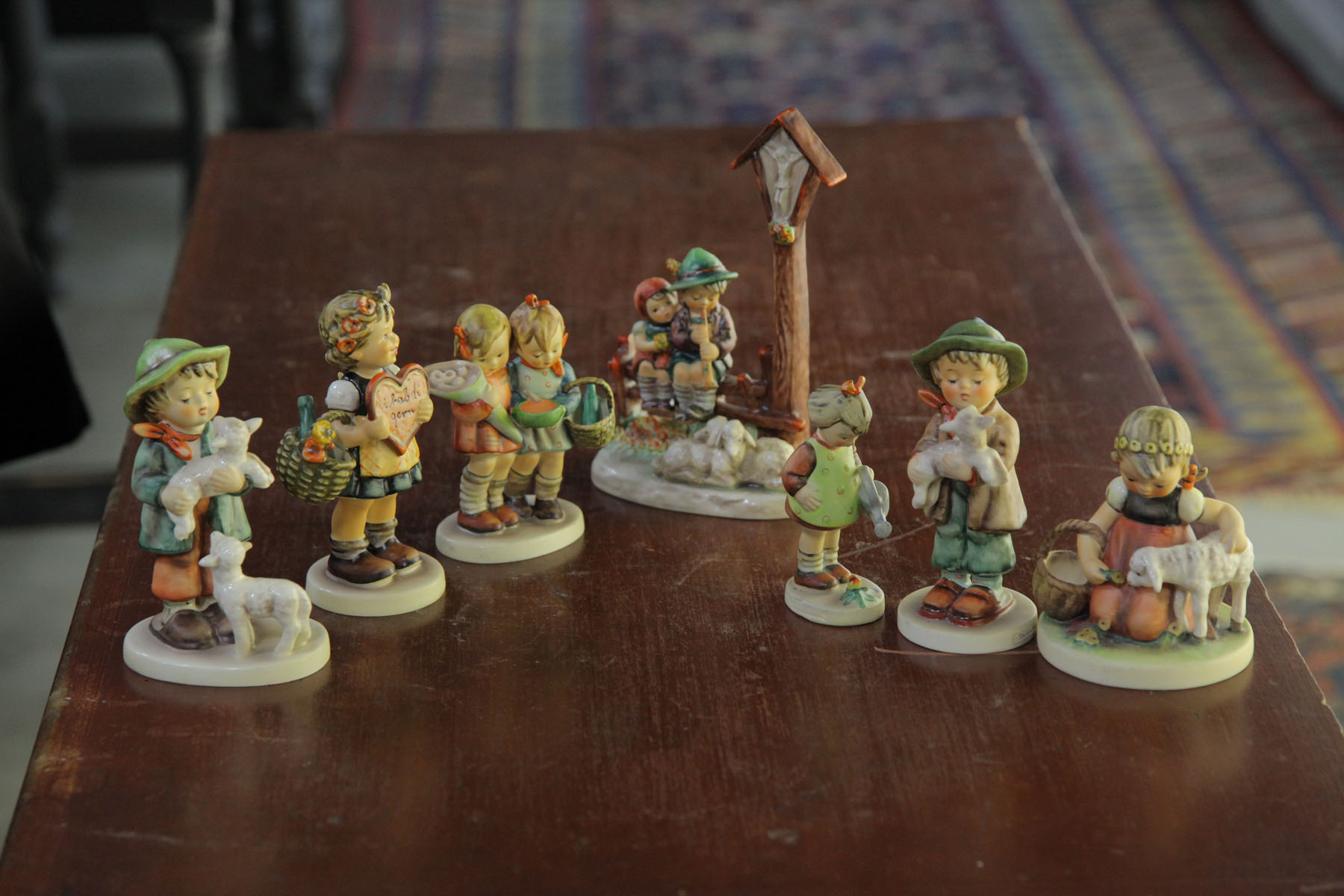 SEVEN HUMMEL FIGURINES.  German 